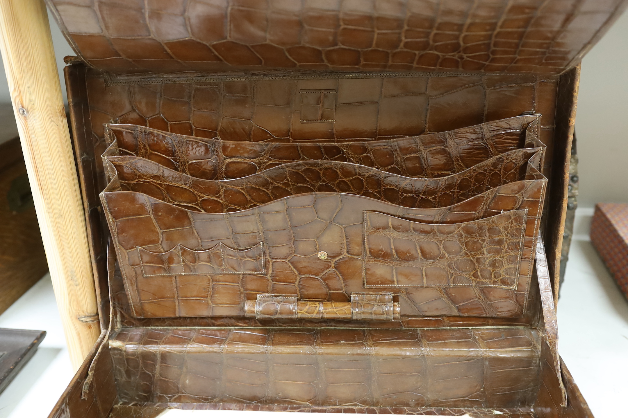 A Finnigans crocodile leather attaché case, pre 1940, with interior figments and blotter, 45cm wide, 28cm deep